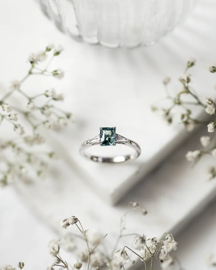 the-jewellers-guild-0-97ct-teal-sapphire-and-diamond-ring-39739530510580_1512x.webp